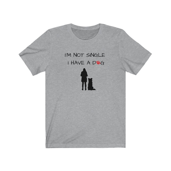 I'm Not Single I Have A Dog - Image Description - Heather Grey t-shirt with I'm Not Single, I have a dog in black text with a red paw print in place of the O in dog. Under the saying, a black silhouette of a woman standing next to a sitting boarder collie dog silhouette. 