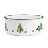 Tumbled Christmas Tree Enamel Bowl – Image Description – This white enamel bowl with a silver rim has a line drawing of a green Christmas tree on its side with 2 red balls visible. Nest to this partial tree, there is another green Christmas tree with 3 red balls and a yellow star on top with 2 small green balls on each side of the tree. Next to this is an image of a black silhouette of a dachshund dog jumping onto the line drawn Christmas tree that is on its side with 4 red balls in disarray. 