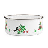 Tumbled Christmas Tree Enamel Bowl – Image Description – This white enamel bowl with a silver rim has 2 line drawing of a green Christmas trees with red balls and a yellow star on top with 2 small green balls on each side of the tree. In the middle of the bowl is an image of a black silhouette of a dachshund dog jumping onto the line drawn Christmas tree that is on its side with 3 red balls in disarray.  