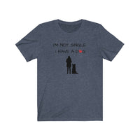 I'm Not Single I Have A Dog - Image Description - Heather Navy t-shirt with I'm Not Single, I have a dog in black text with a red paw print in place of the O in dog. Under the saying, a black silhouette of a woman standing next to a sitting boarder collie dog silhouette. 