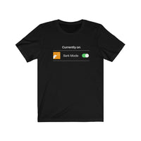 Currently On - Bark Mode Jersey Tee  - Black t-shirt. Currently On is above an orange square showing a white barking dog, Bark Mode, and then an image of the toggle turned on.