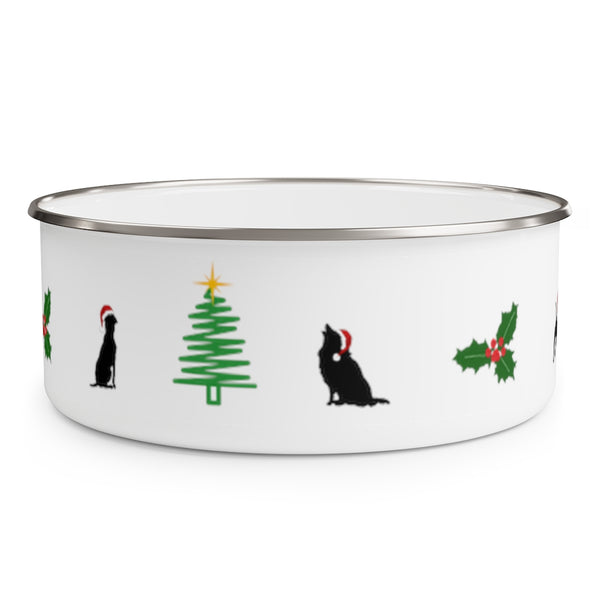 Dogs Holiday Cheer Enamel Bowl - White bowl with stainless steel rim decorated with silhouettes of 2 dogs wearing santa hats sitting on either side of a green line Christmas tree with a yellow star and a holly with 3 berries about the same size as the tree..