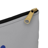 Best Friend Silhouette Dirty Mask Organizer - This image highlights a small corner of a light grey bag with a black zipper with a gold pull and a bit of blue print visible in the bottom corner of the image. 