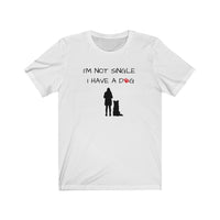 I'm Not Single I Have A Dog - Image Description - White t-shirt with I'm Not Single, I have a dog in black text with a red paw print in place of the O in dog. Under the saying, a black silhouette of a woman standing next to a sitting boarder collie dog silhouette. 